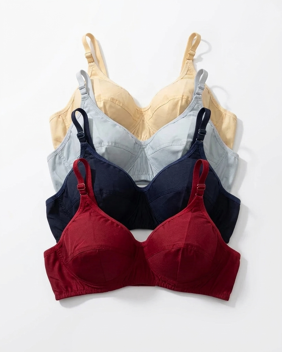 Three wireless underwire bras in different colors are arranged in a vertical stack on a white background. The front bra is a deep burgundy red, the middle bra is navy blue, and the back bra is a pale yellow-beige.