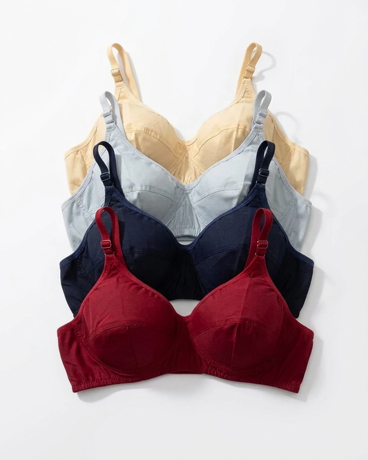 Three wireless underwire bras in different colors are arranged in a vertical stack on a white background. The front bra is a deep burgundy red, the middle bra is navy blue, and the back bra is a pale yellow-beige.